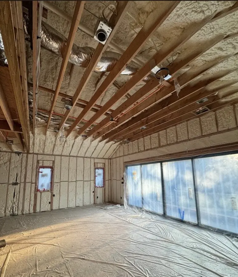 Interior walls and ceiling insulated with spray foam during new construction in Jefferson City